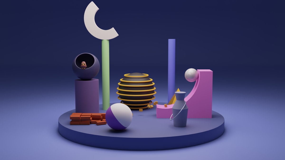 Playful 3D shapes arranged on a small stage