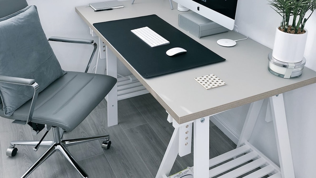 A clean, minimalist desk setup with a monochrome palette